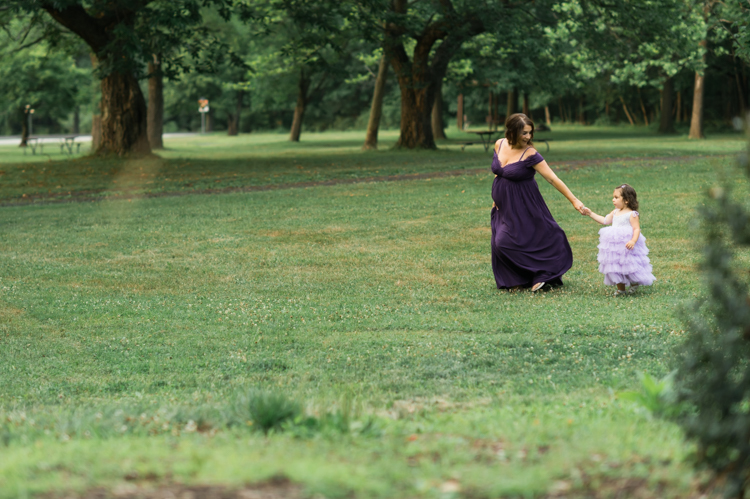 I was thrilled when Michelle from Pink Comb Studio reached out for her maternity photos. Following COVID-19 rule, keeping social distance I photographed Michelle and her two beautiful girls at Watchung Mountain NJ. With overcast weather three trees and grass showed such a rich deep green colors. I love bold rich colors in my photos as much as I love sunset golden hour. Michelle was just glowing and looked so beautiful. Was so happy to have such a beautiful mama in front of my camera before Michelle becomes mama of three girls. I can not wait to see her new baby girl and see her family grow. Michelle Surgent’s maternity session captured by Karis from heykaris.
